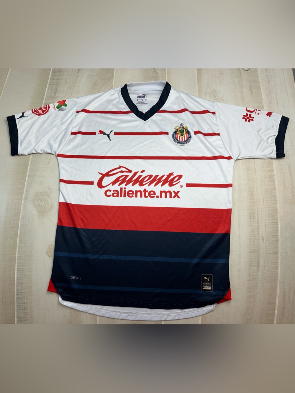 Puma Caliente Performance Soccer Jersey with Red Stripe and Navy Collar